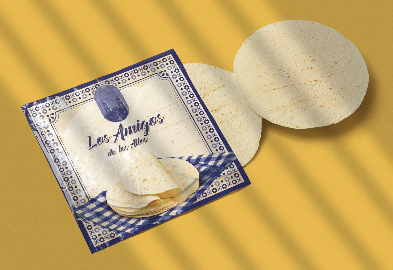 Bag of Los Amigos de los Altos flour tortillas with two tortillas beside it